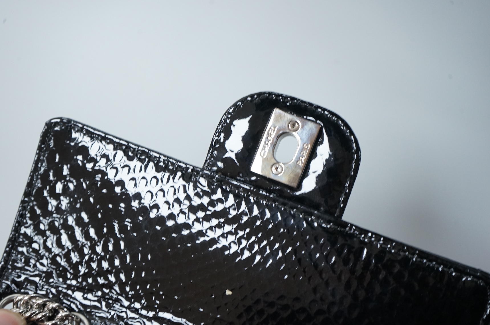 A Chanel patent black mini python handbag with silver hardware, date code 12008922, with dust bag, original paperwork, authenticity card and box, 17cm wide, Provenance: Purchased by the vendor Paris